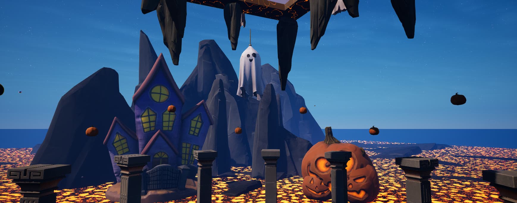 Casa encantada y calabaza gigante alrededor de la arena